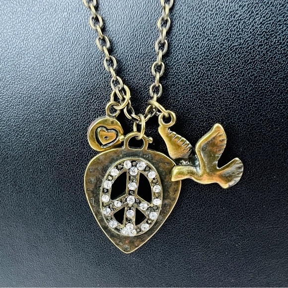 Jewelry - Beautiful bronze stone, 3 charm peace sign, heart, bird,  long costume necklace